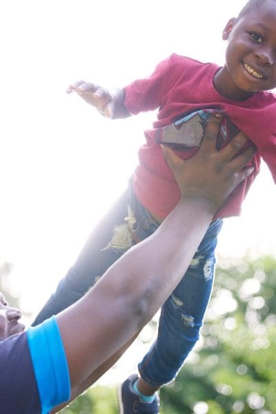 I love hearing my sons laugh. Shot of a young boy playing with his father outside